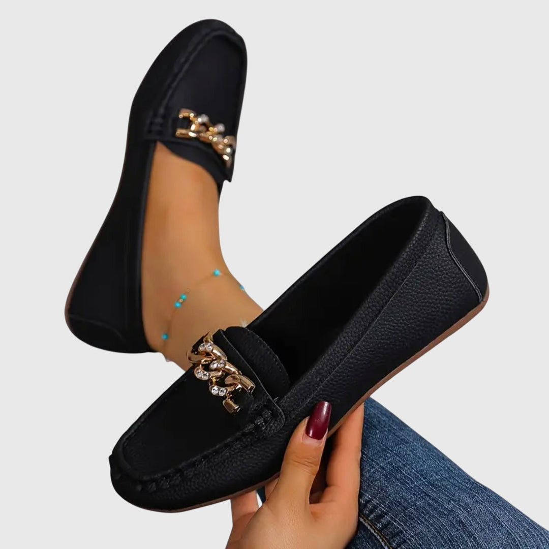 Woman wearing comfortable orthopedic loafers, walking effortlessly. Stylish flats for all-day comfort.