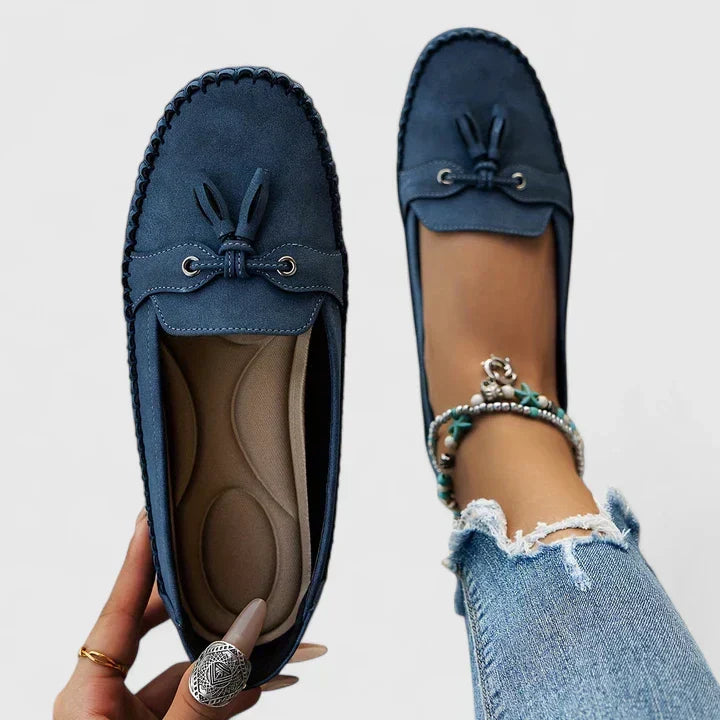 Women's orthopedic loafers with stylish tassel & bow accents, offering comfort & support for everyday wear.
