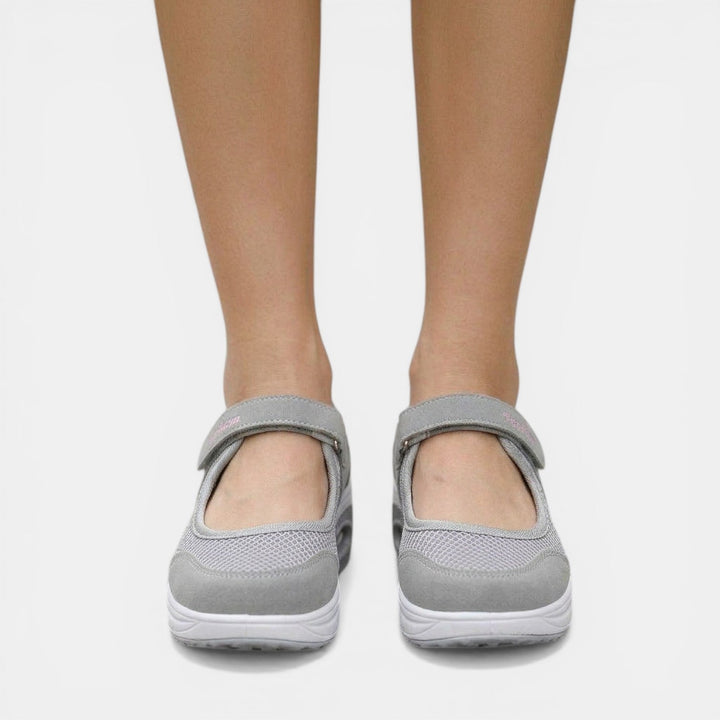 Grey women's orthopedic Mary Jane sneakers with adjustable strap. Platform comfort shoes for casual, active support.