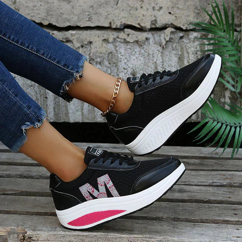 Breathable, lightweight women's orthopedic walking sneakers featuring a supportive wedge sole.