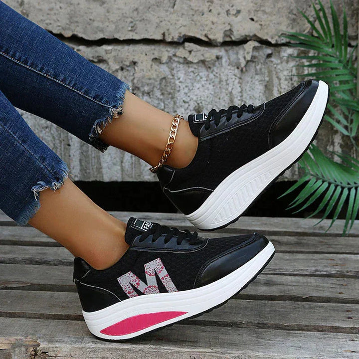 Breathable, lightweight women's orthopedic walking sneakers featuring a supportive wedge sole.