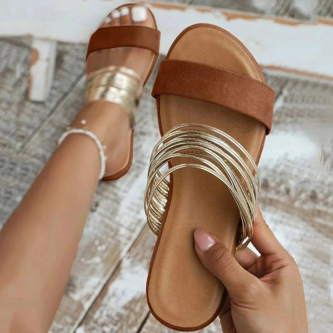 Women's casual metallic slide sandals, ideal summer shoes with multi-strap design & orthopedic support.