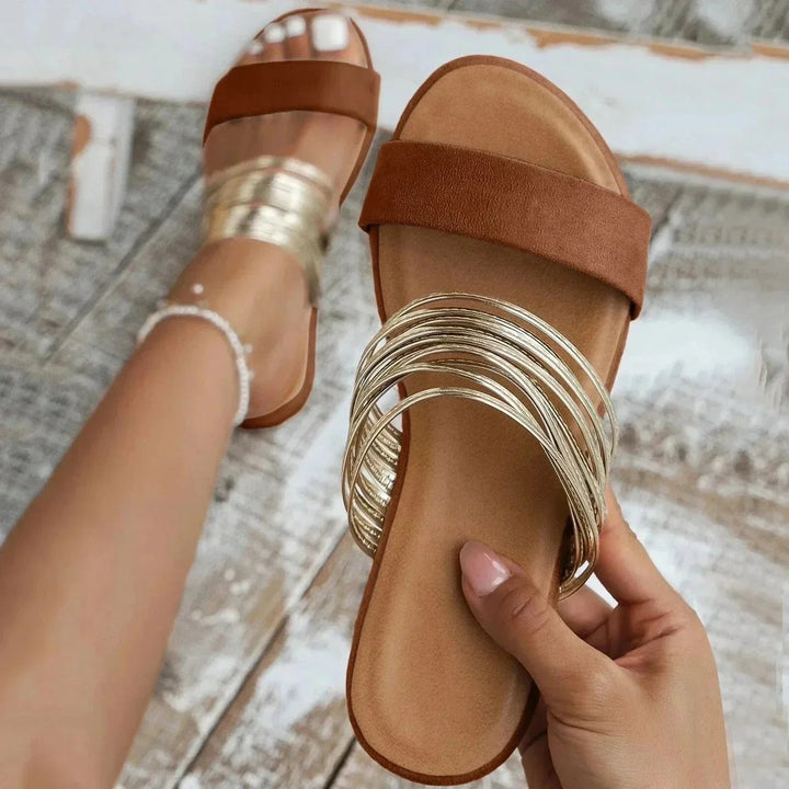 Women's casual metallic slide sandals, ideal summer shoes with multi-strap design & orthopedic support.