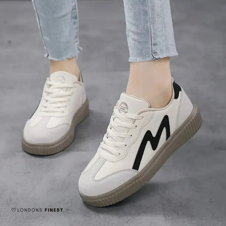 Stylish women's platform orthopedic sneakers with unique wavy lace-up, providing comfort & support for foot health.