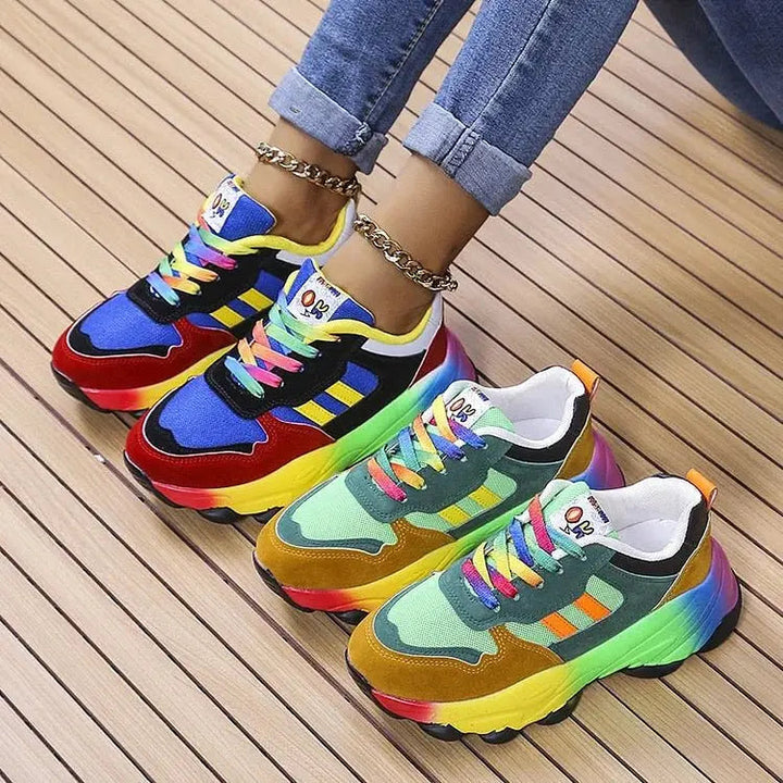Vibrant women's slip-on rainbow trainers with wide fit & orthopedic arch support for easy walking.