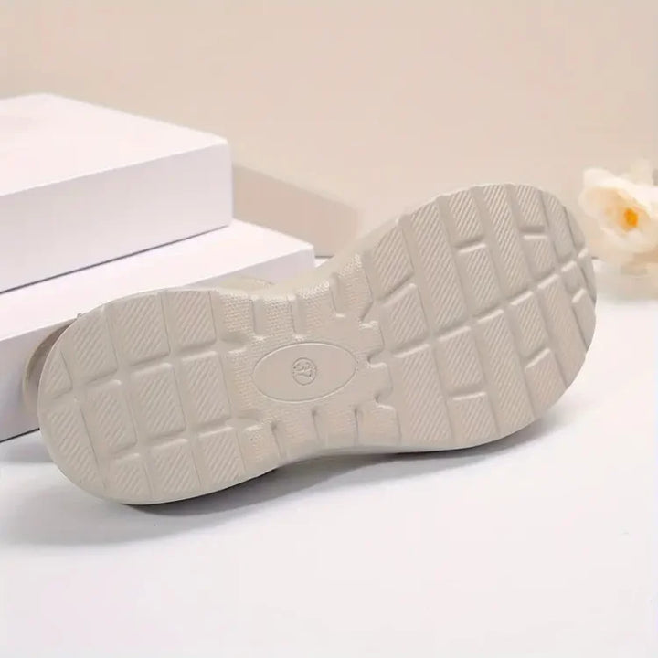 Woman wearing supportive orthopedic sandals for daily wear.
