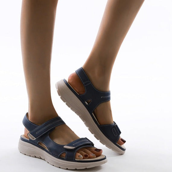 Therapeutic women's sandals with adjustable straps, providing orthopedic arch support & cushioned comfort.