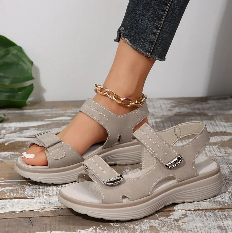 Front view of trendy women's orthopedic sandals in various colors.