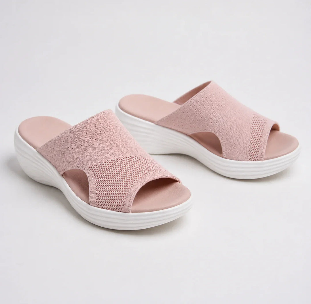Women's orthopedic slide sandals with arch support, comfortable wedge sole, & adjustable strap for summer pain relief.