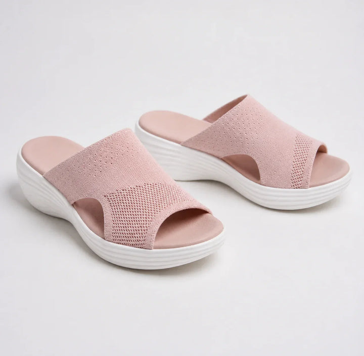 Women's orthopedic slide sandals with arch support, comfortable wedge sole, & adjustable strap for summer pain relief.