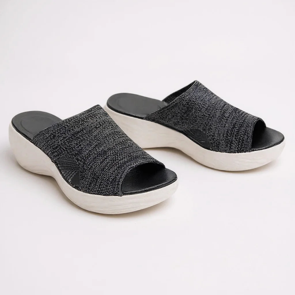 Stylish women's open-toe wedge slide sandals. Orthopedic design provides arch & posture support for all-day comfort.