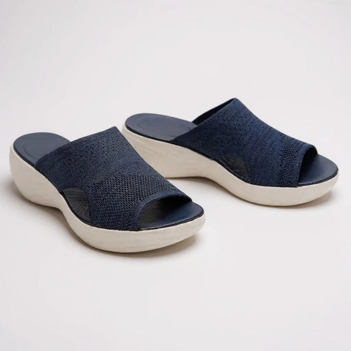 Comfortable women's arch support slide sandals. Orthopedic wedge sole & adjustable strap for summer walking & style.