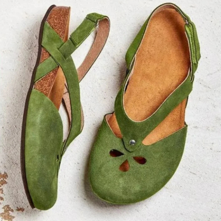 Women's orthopedic slingback sandals with cross-strap, offering arch support for comfortable daily wear.