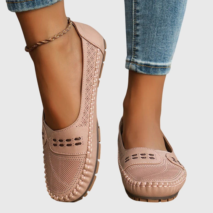 Slip-on women's walking shoes with orthopedic arch support for improved posture.