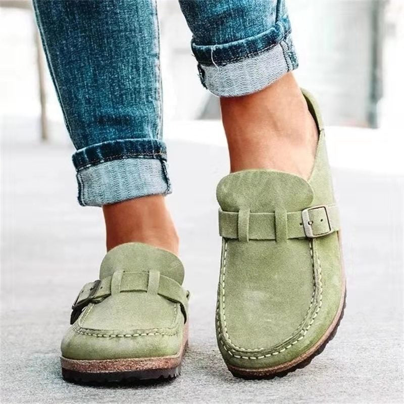 Woman wearing comfortable orthopedic slip-on sandals, ideal for supportive all-day walking & casual everyday wear.
