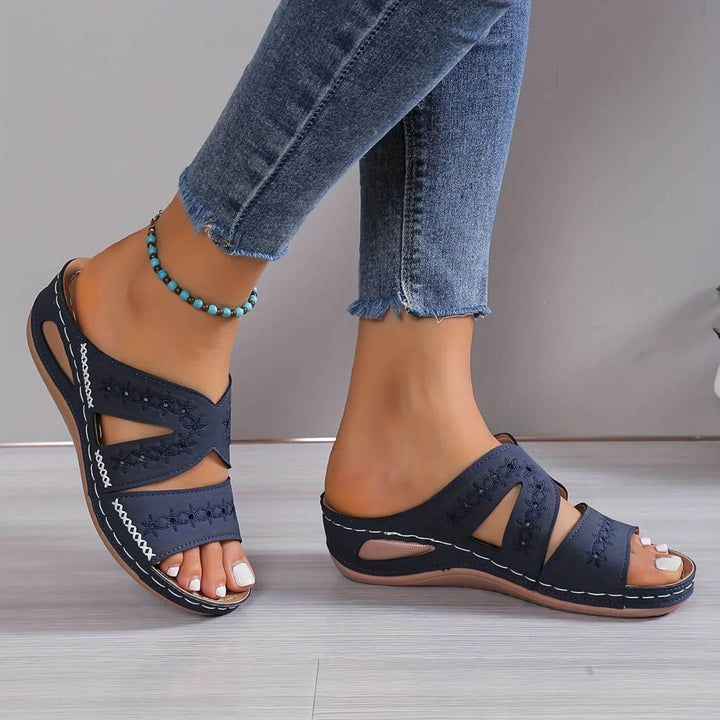 Women's orthopedic slip-on sandals with arch support for all-day comfort.