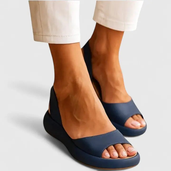 Slip-on women's sandals, designed with orthopedic cushioning for all-day comfort and support.