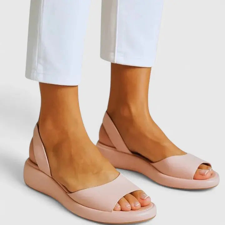 Stylish women's orthopedic summer sandals offering cushioned support and easy slip-on convenience.