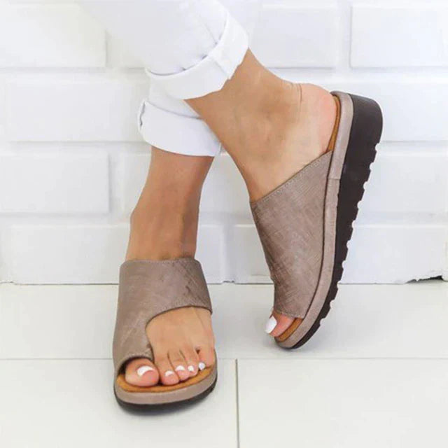 Orthopedic women's sandals, slip-on style with toe support for posture correction & foot health.