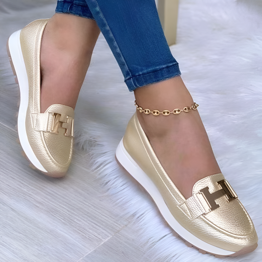 Side view of women's orthopedic shoes, highlighting supportive design and casual style.