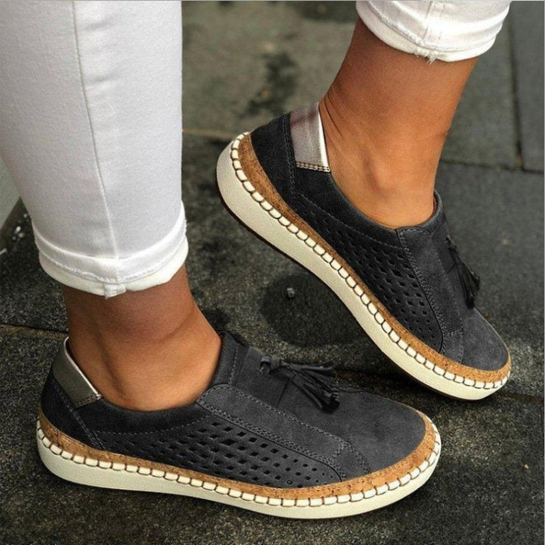 Women's orthopedic slip-on slippers, lightweight with arch support for comfort & everyday foot relief.