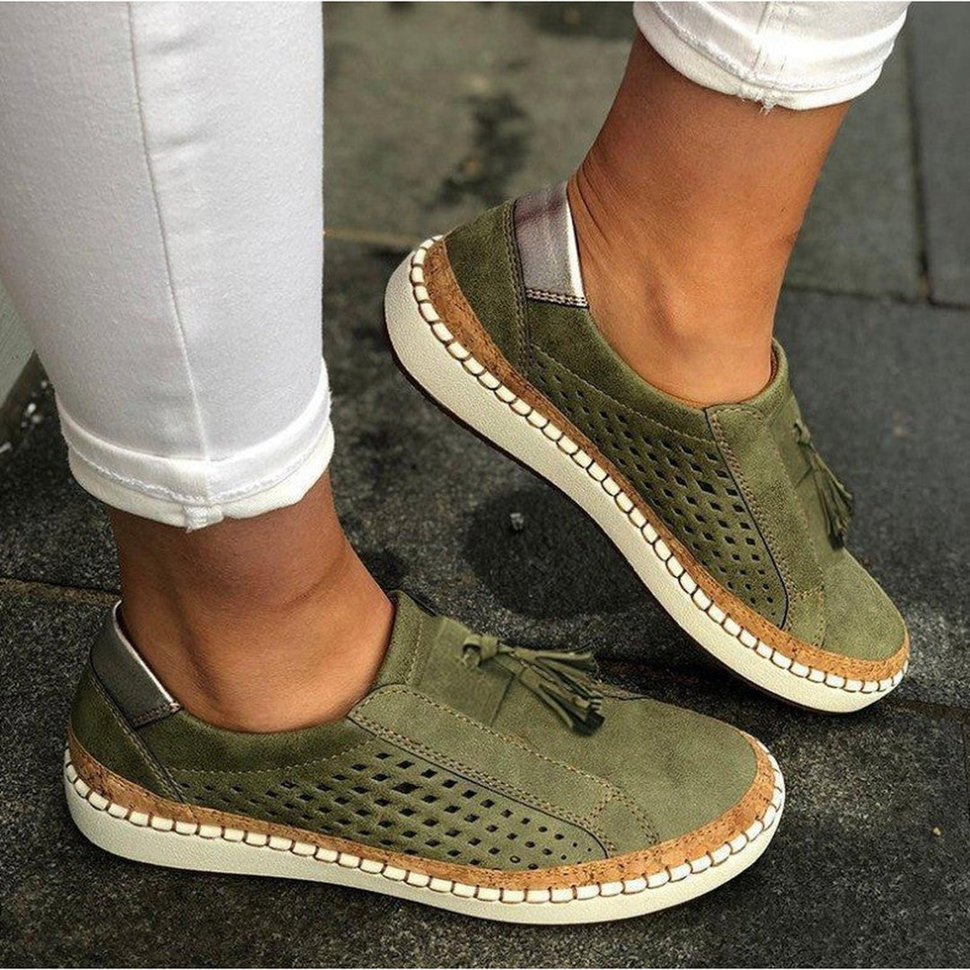 Ergonomic women's orthopedic slippers with supportive arch & soft lining, perfect for indoor casual wear.