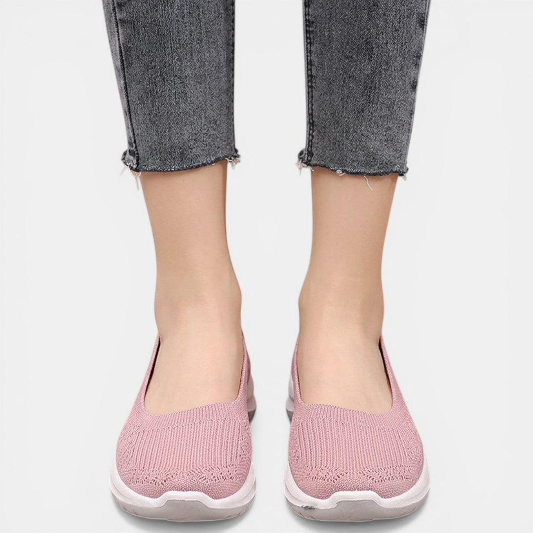 Stylish women's slip-on sneakers with superior orthopedic arch support for comfortable walking.