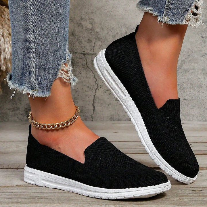 Women's wide-fit slip-on comfort trainers, cushioned with orthopedic arch support for active lifestyles.