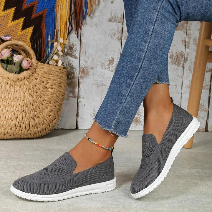 Orthopedic slip-on trainers for women, promoting foot wellness with superior arch support and cushioning.