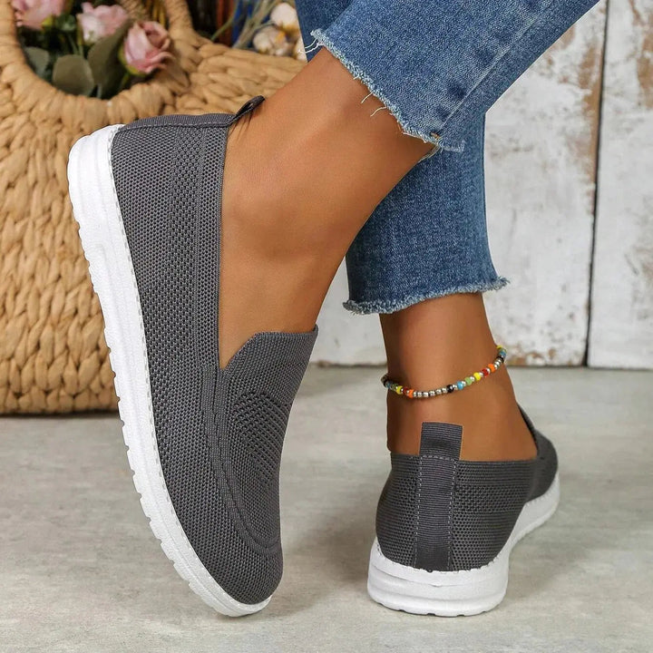 Women's active slip-on trainers: orthopedic arch support, cushioned, wide fit for all-day comfort.
