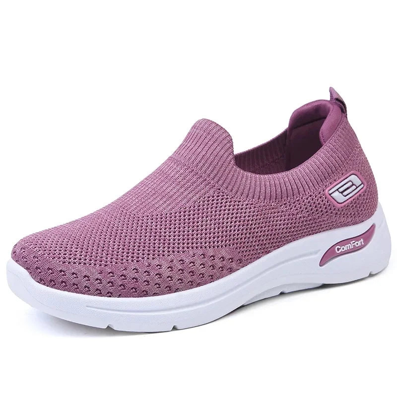 Breathable women's slip-on trainers; casual, lightweight, & orthopedic for everyday comfortable walking.