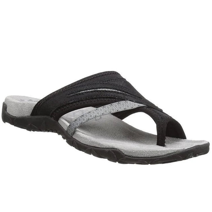 Comfortable women's orthopedic slippers designed for foot pain relief, featuring arch support & toe-loop.