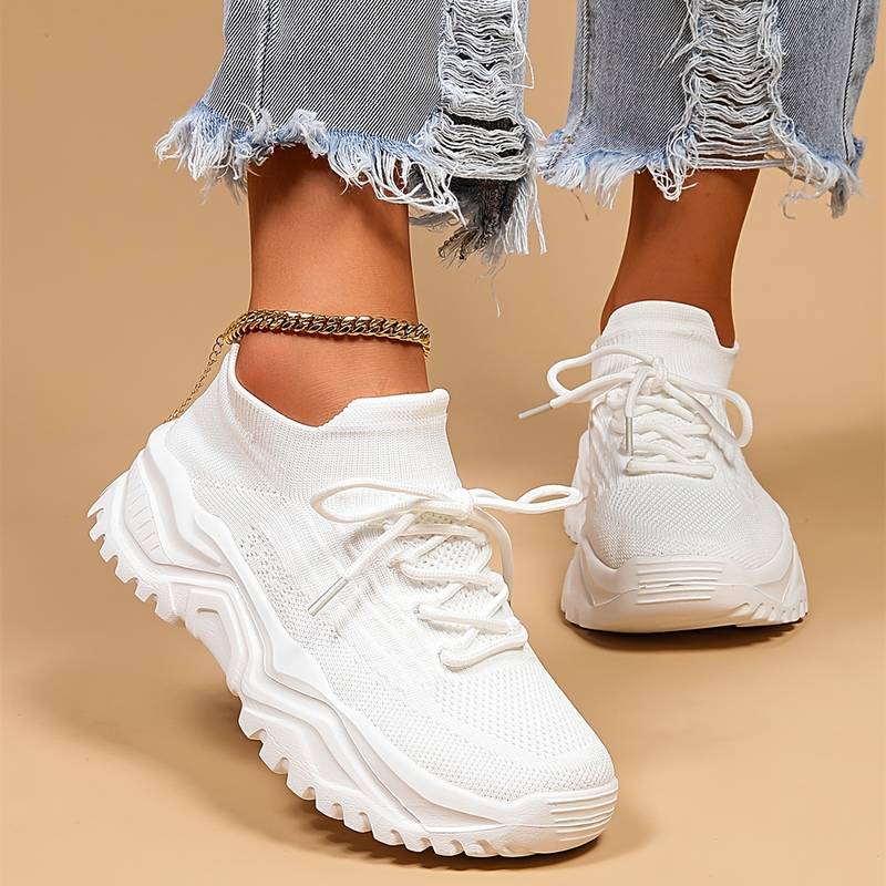 Women's orthopedic sneakers in white, offering superior arch support and comfort for daily wear.