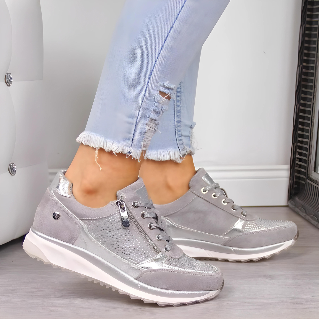 Close-up of the cushioned sole of women's supportive walking shoes.