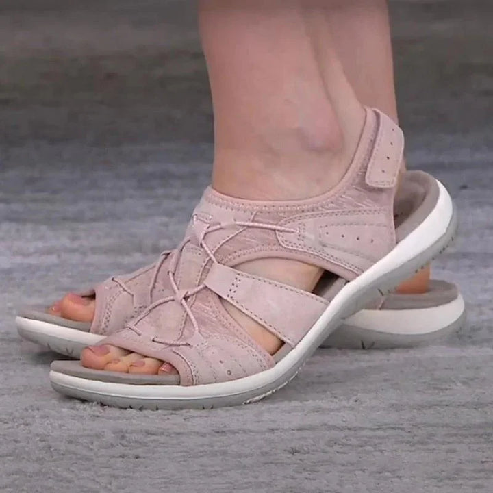 Open-toe women's comfort sandals with adjustable cut-out design, providing excellent foot support & style.