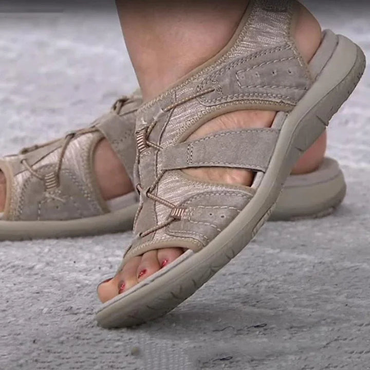 Women's casual sandals offering arch support & comfort, with adjustable straps & modern cut-out design.