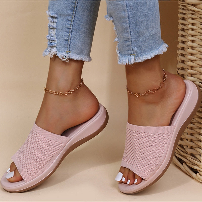 Comfortable women's summer slippers with arch support, adjustable straps, and breathable design for daily wear.
