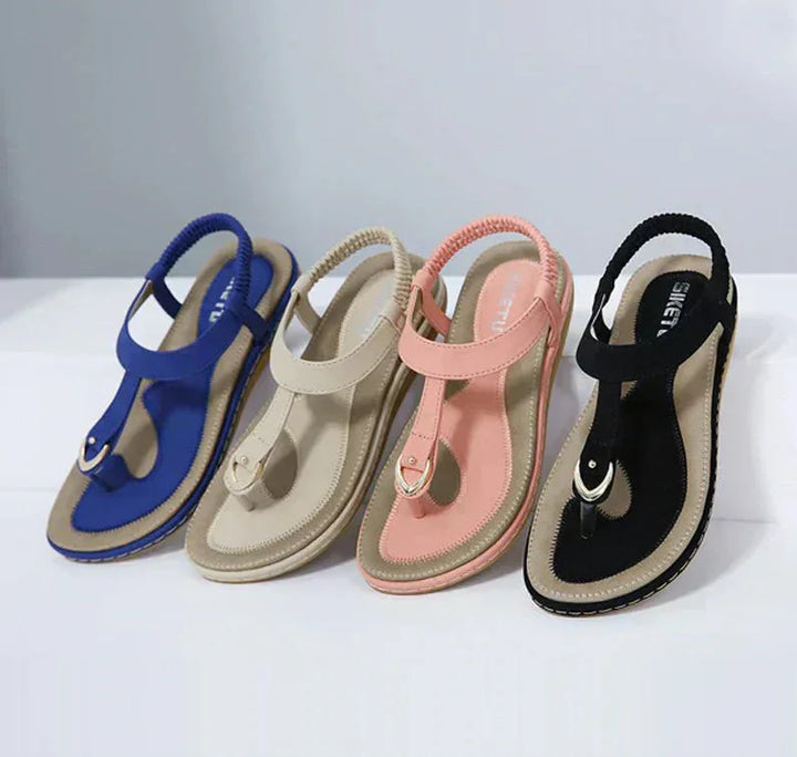 Women's orthopedic T-strap sandals with arch support for comfortable summer wear.