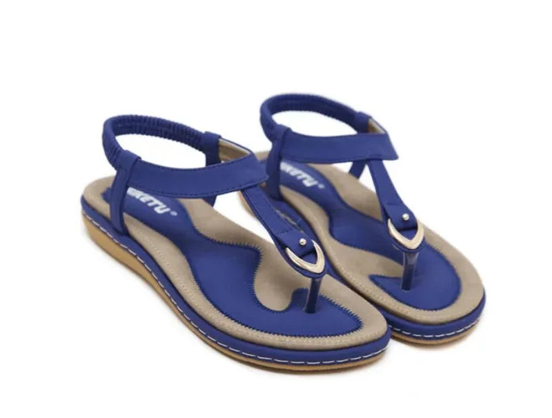 Casual women's flat T-strap sandals offering orthopedic arch support for daily comfortable wear.