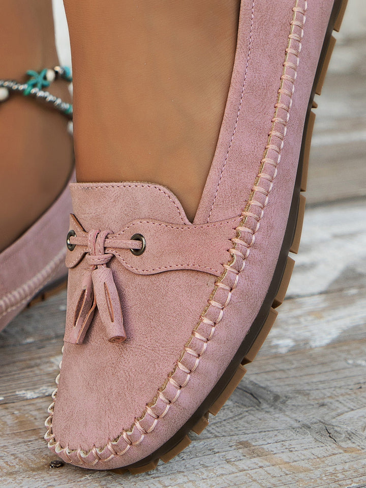 Women's fashionable orthopedic loafers, featuring tassels, arch support, and comfortable design.
