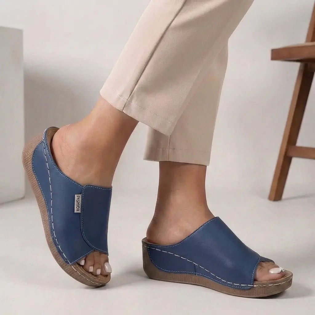 Elegant women's open toe wedge sandals, perfect casual slip-on footwear for summer comfort.
