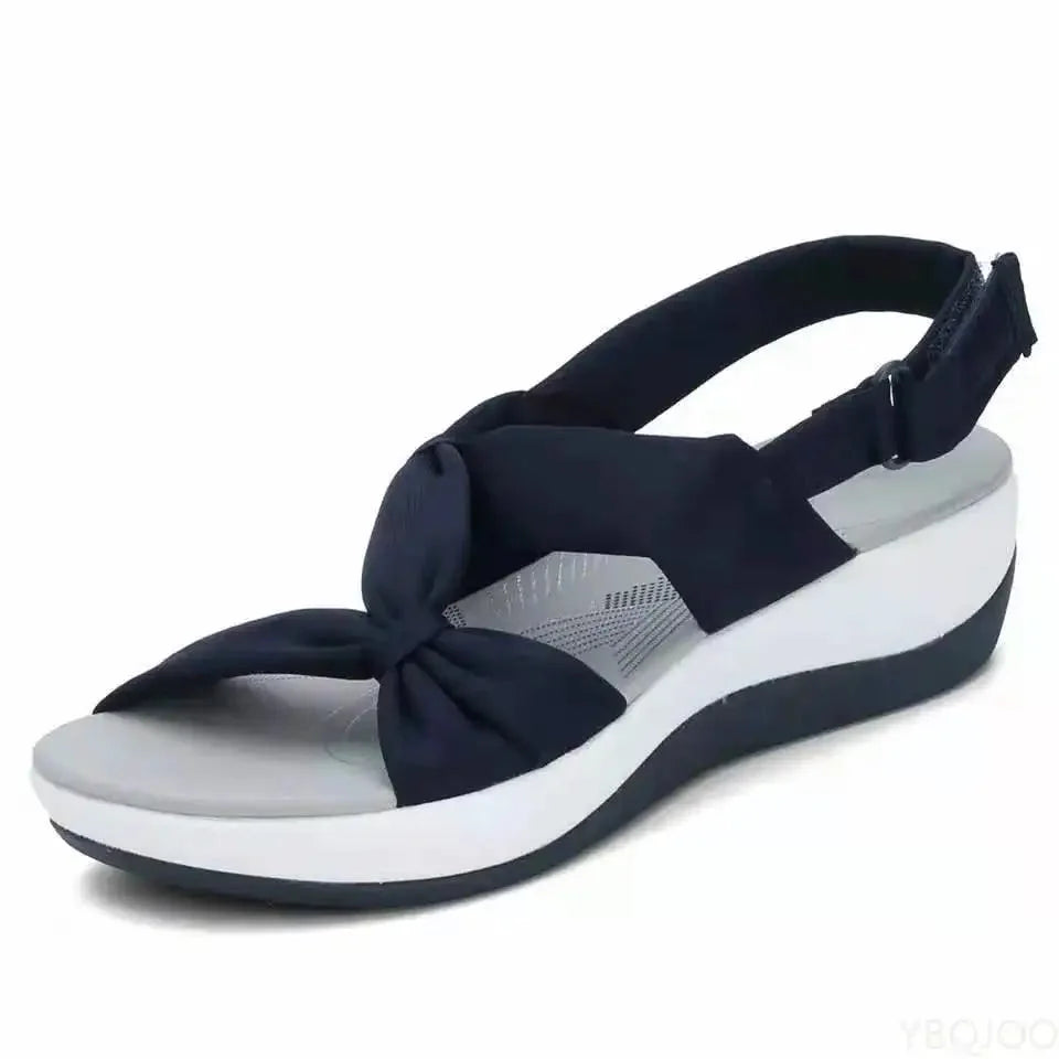Women's everyday comfort wedge sandals with adjustable strap for a secure fit & superior arch support.