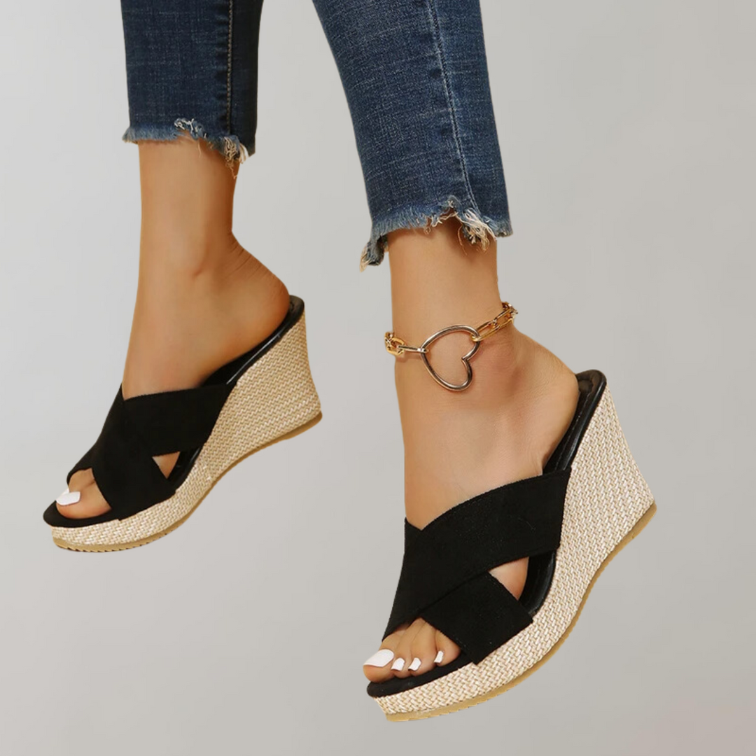 Comfortable women's wedge sandals featuring crisscross straps, orthopedic support, and essential arch comfort.