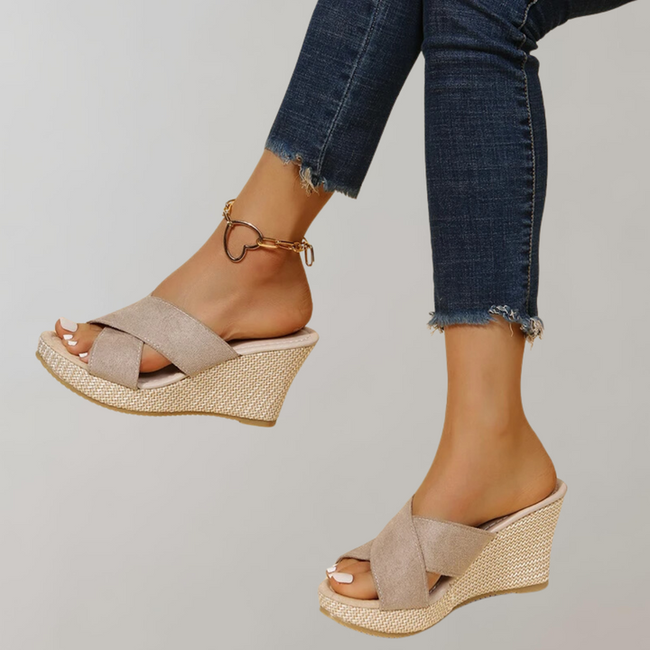 Women's stylish orthopedic wedge sandals with crisscross straps, ideal for comfortable casual summer wear.