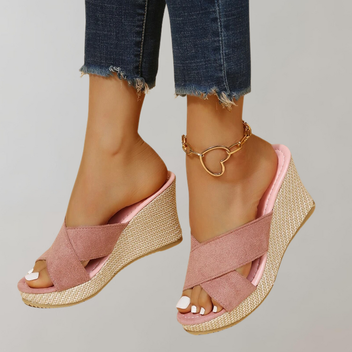 Elegant women's orthopedic crisscross wedge sandals, providing arch support for all-day summer comfort.