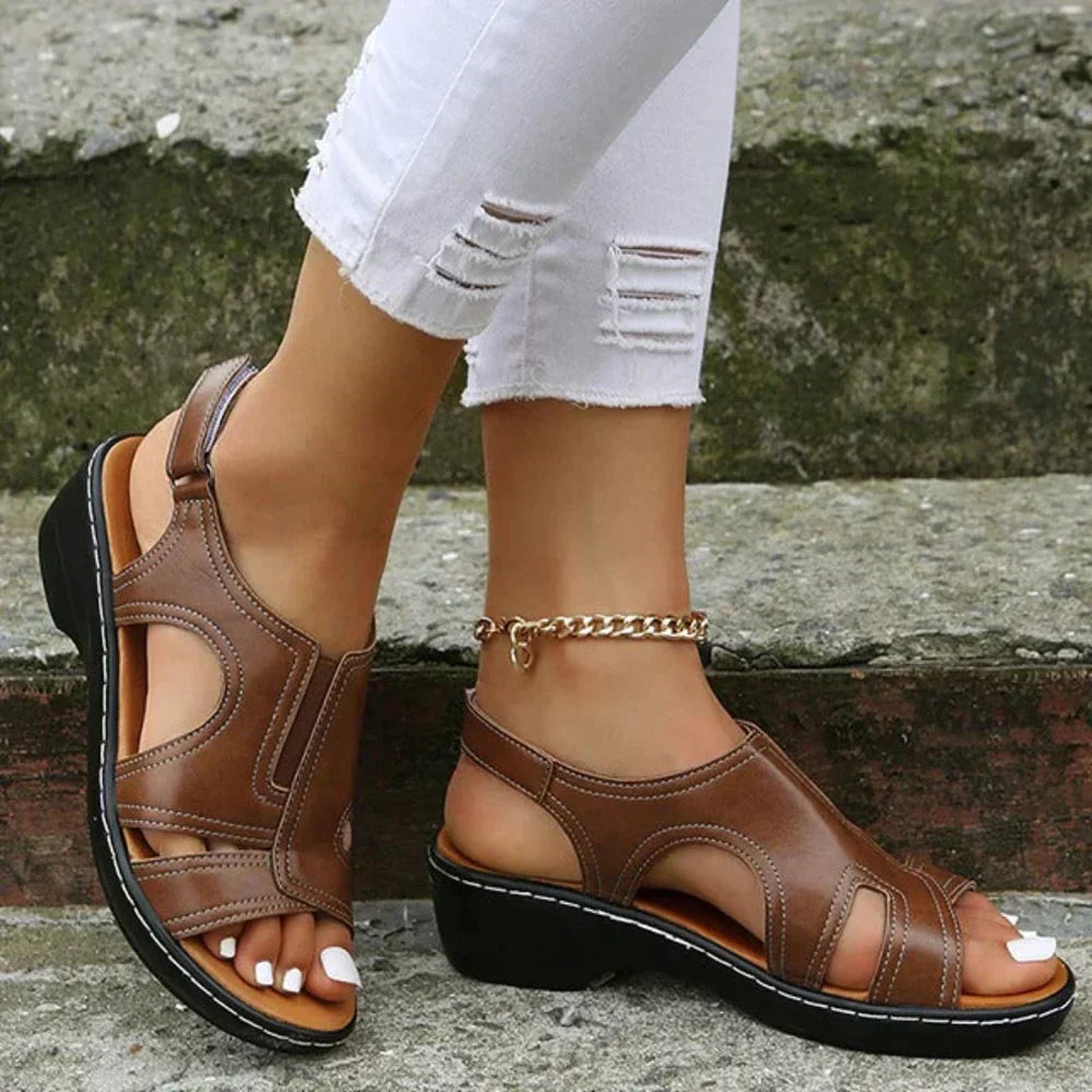 Women's orthopedic wedge sandals with cutout design for all-day comfort & arch support.