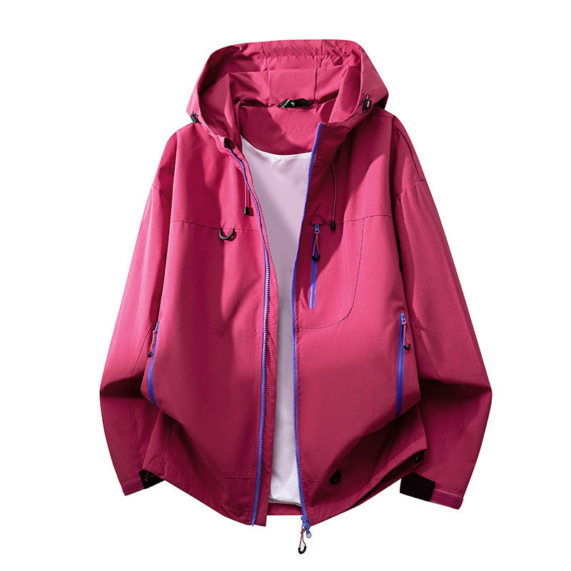 Versatile women's hooded jacket for all-weather travel & outdoor sports, functional & stylish.