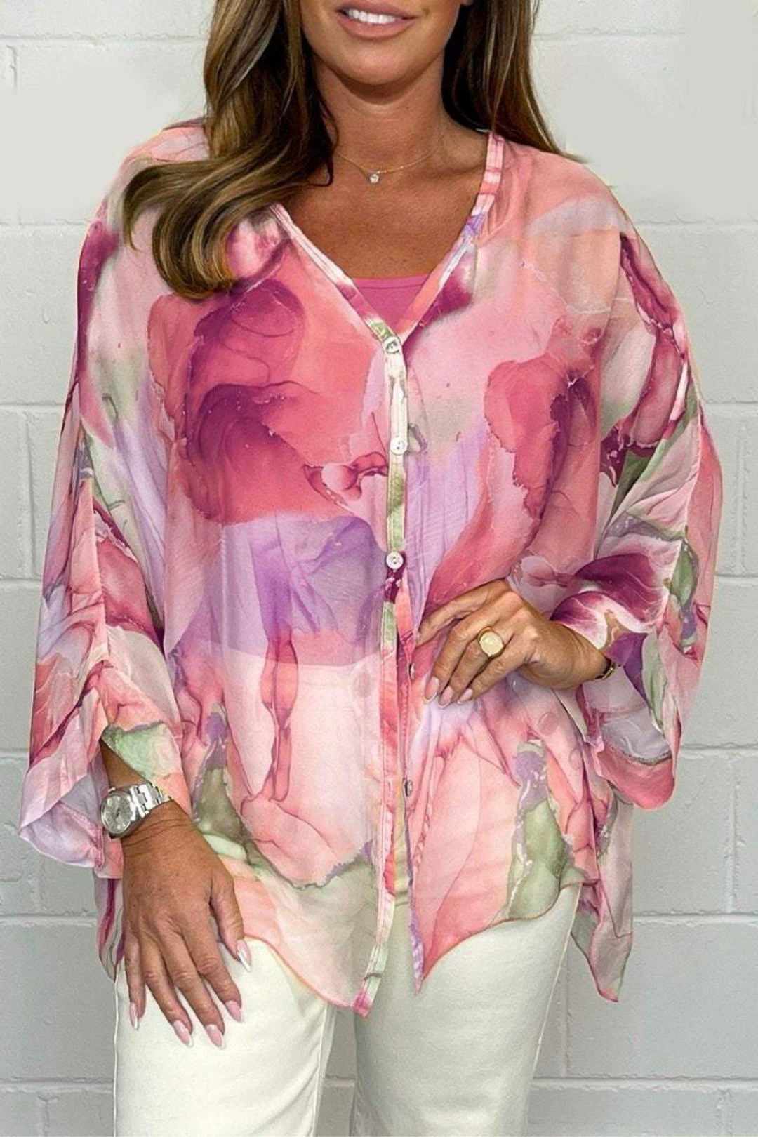 Casual chic women's blouse, oversized fit with artistic abstract print. Versatile long sleeve v-neck top for modern fashion.