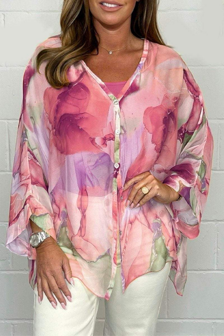 Casual chic women's blouse, oversized fit with artistic abstract print. Versatile long sleeve v-neck top for modern fashion.