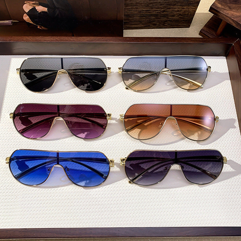 Women's oversized aviator sunglasses with UV protection, metal frame, stylish fashion eyewear for summer.